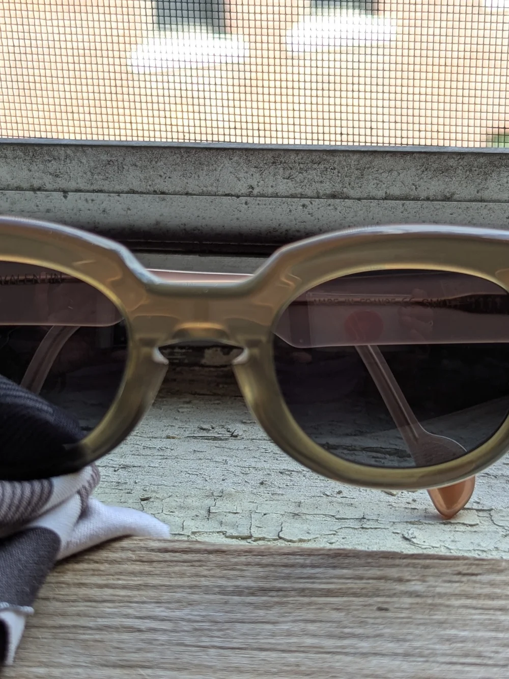 Anne Et Valentin Sunglasses with Brown/Olive Front And Peach temples.